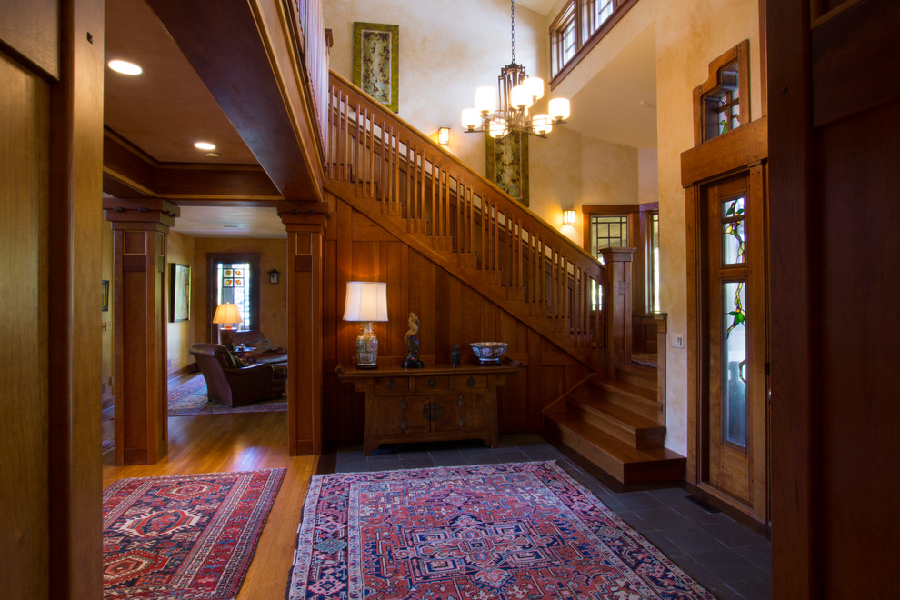 Inspiration for a mid-sized arts and crafts wood u-shaped staircase in Denver with wood risers.