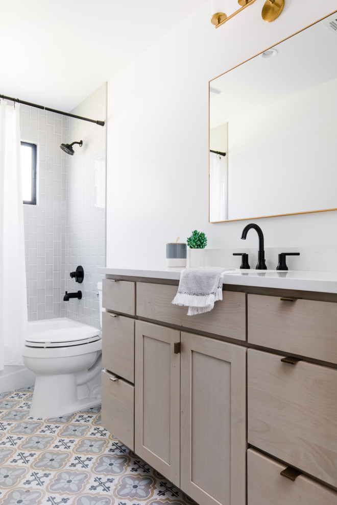 Inspiration for a mid-sized transitional kids' gray tile ceramic tile and multicolored floor bathroom remodel in Phoenix with shaker cabinets, quartz countertops and a built-in vanity