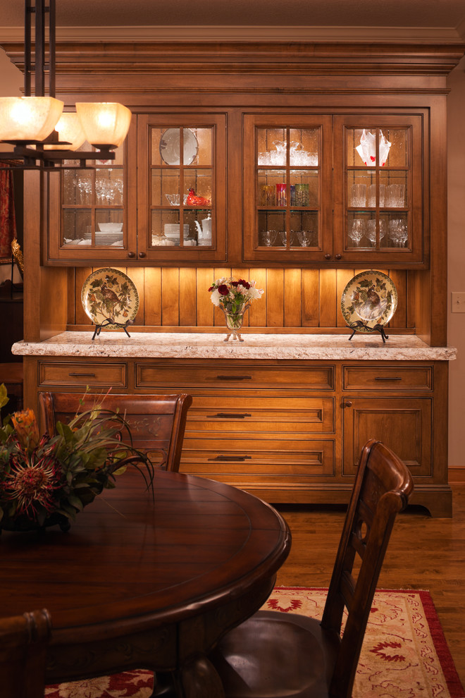 Design ideas for a traditional kitchen in Minneapolis with glass-front cabinets.