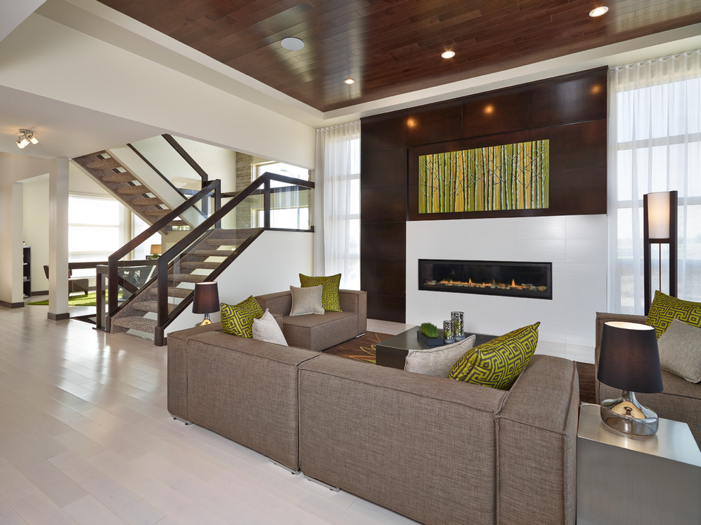 Inspiration for a contemporary formal open concept living room in Calgary with multi-coloured walls, light hardwood floors, a ribbon fireplace, a tile fireplace surround and no tv.