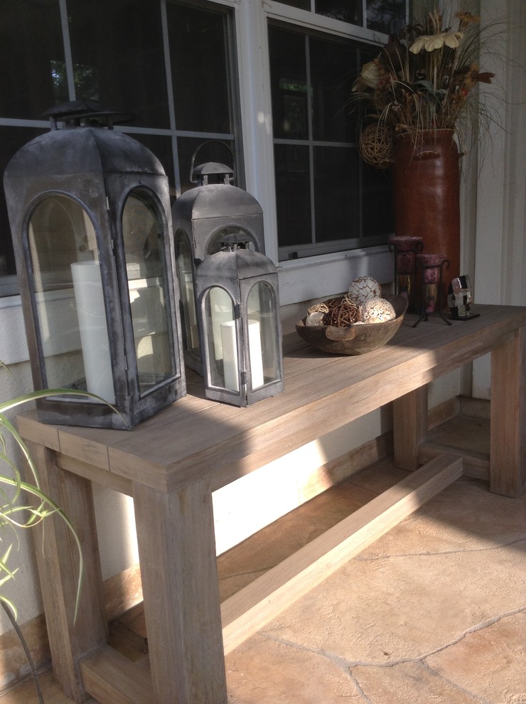 Trendy backyard stamped concrete patio kitchen photo in Houston with a roof extension