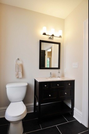 Example of a transitional kids' black tile bathroom design in St Louis with furniture-like cabinets