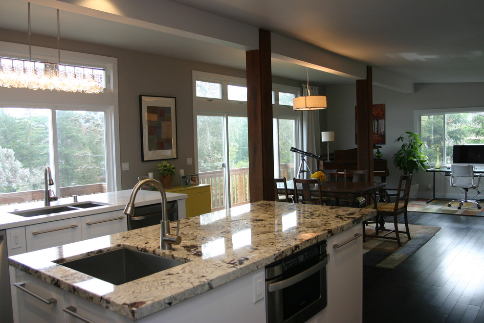 Photo of a contemporary eat-in kitchen in San Francisco with an undermount sink, flat-panel cabinets, white cabinets, quartz benchtops, stainless steel appliances, dark hardwood floors, multiple islands and multi-coloured benchtop.