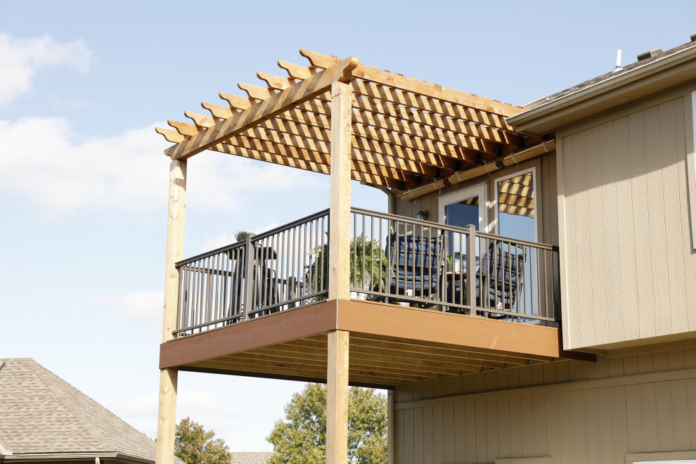 Deck - small contemporary backyard second story deck idea in Other with a pergola