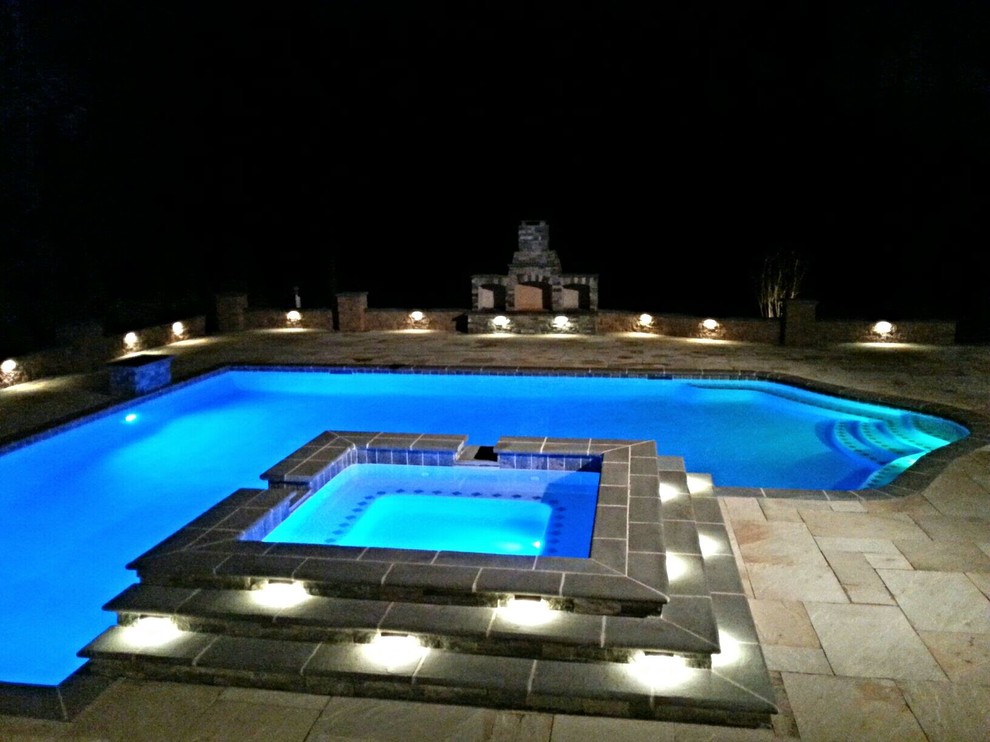 Example of a large transitional backyard tile and custom-shaped hot tub design in Baltimore
