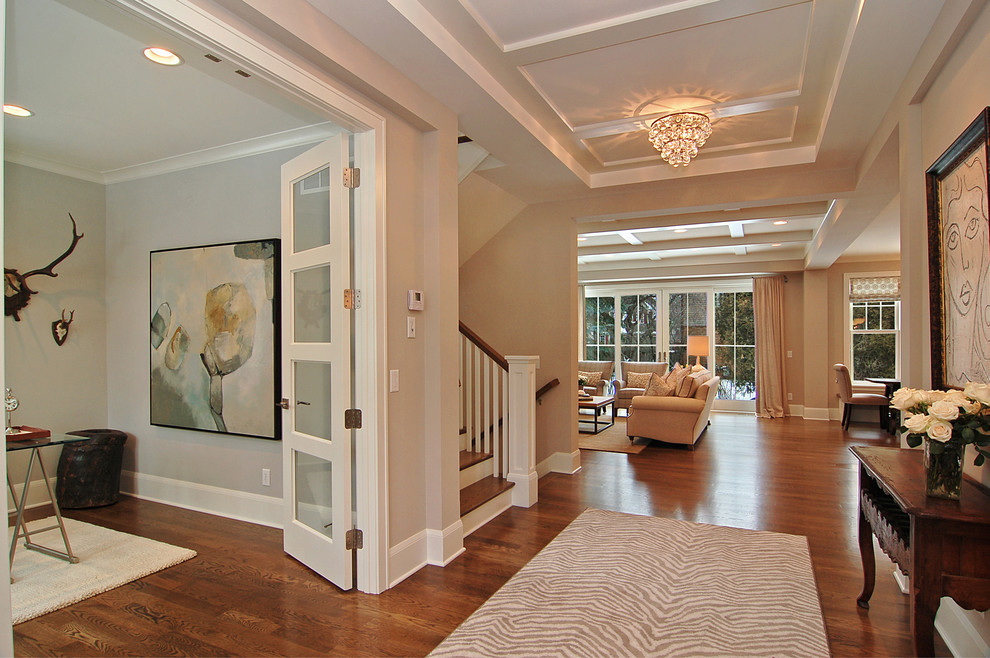 Inspiration for a transitional foyer in Minneapolis with beige walls and medium hardwood floors.