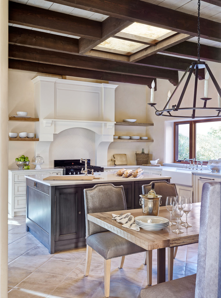 Inspiration for a mediterranean l-shaped eat-in kitchen in Phoenix with a farmhouse sink, open cabinets, medium wood cabinets and with island.