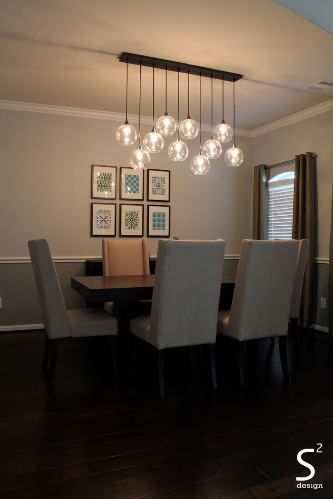 Mid-sized transitional separate dining room in Houston with grey walls, dark hardwood floors and no fireplace.
