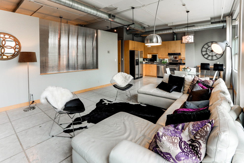 Living room - mid-sized industrial open concept concrete floor living room idea in Toronto with gray walls