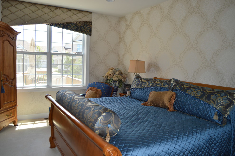 This is an example of a large traditional master bedroom in Boston with multi-coloured walls, carpet and white floor.