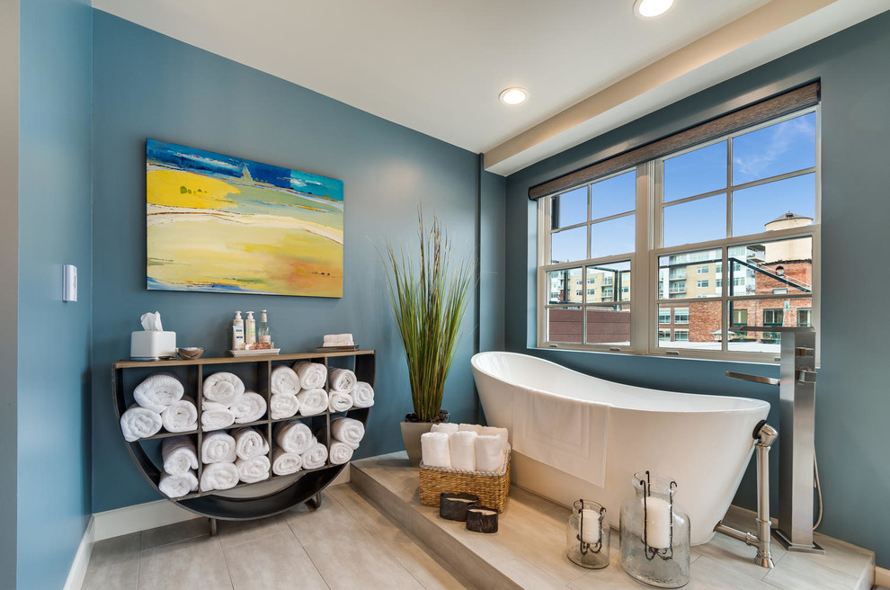 Inspiration for a contemporary master bathroom in Denver with a freestanding tub and blue walls.