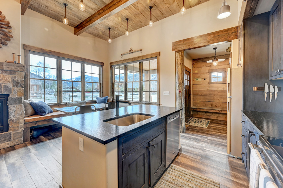 Example of a mountain style kitchen design in Denver