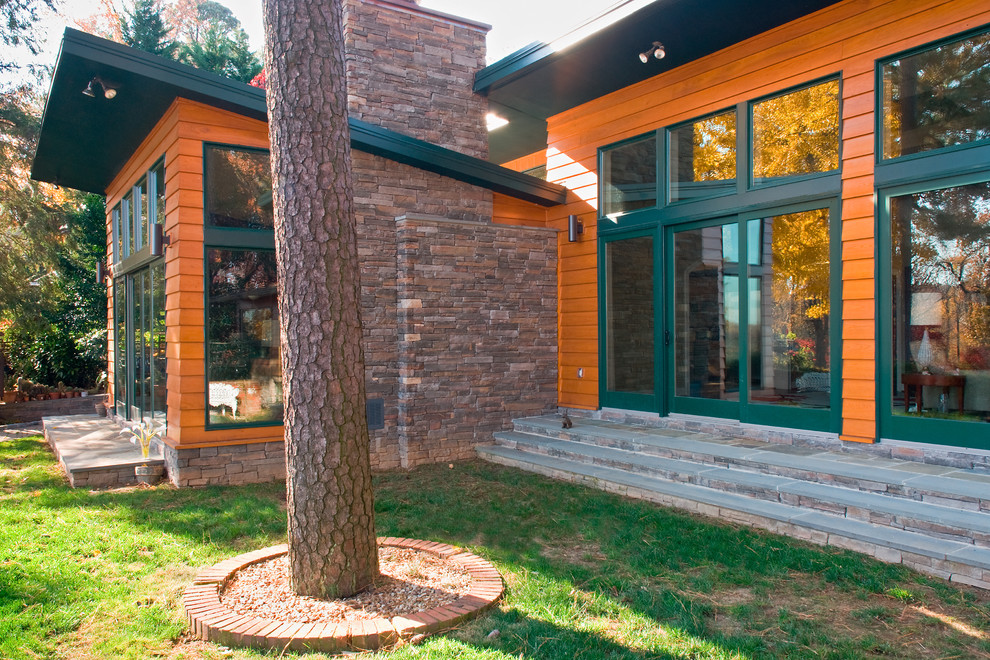 This is an example of a contemporary exterior in Richmond with stone veneer.
