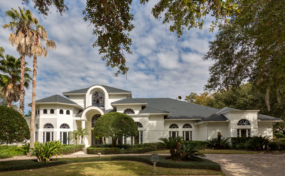 Photo of an expansive transitional two-storey exterior in Orlando.