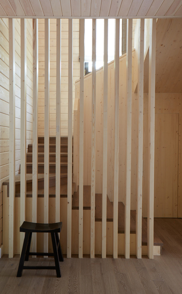 Inspiration for a contemporary wood u-shaped staircase in Moscow with wood risers.