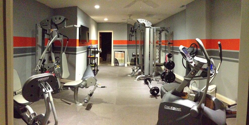 Inspiration for a large home weight room in St Louis with grey walls.