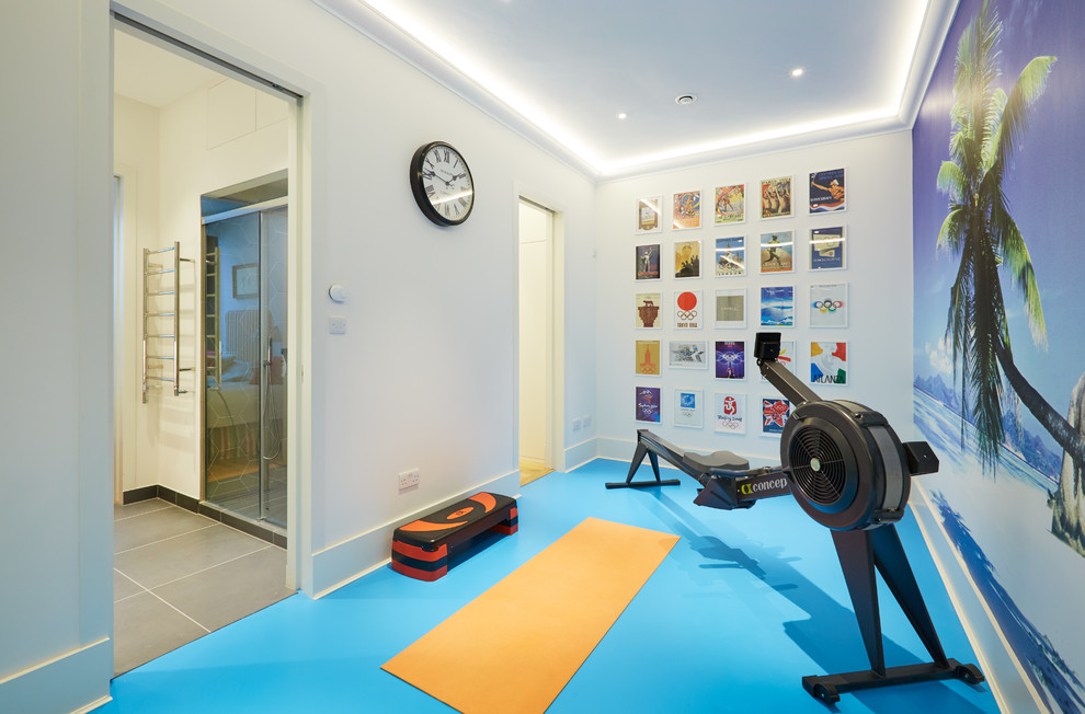 This is an example of a small contemporary home yoga studio in London with blue floor.