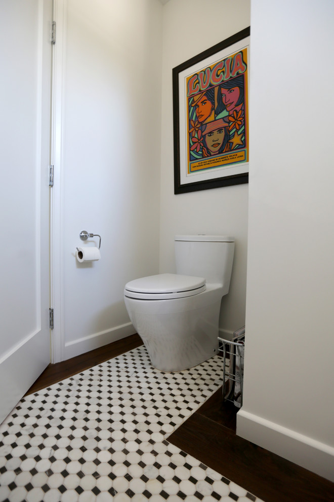 Photo of a large industrial powder room in San Diego with marble benchtops, white tile, a two-piece toilet, an undermount sink, white walls and marble floors.