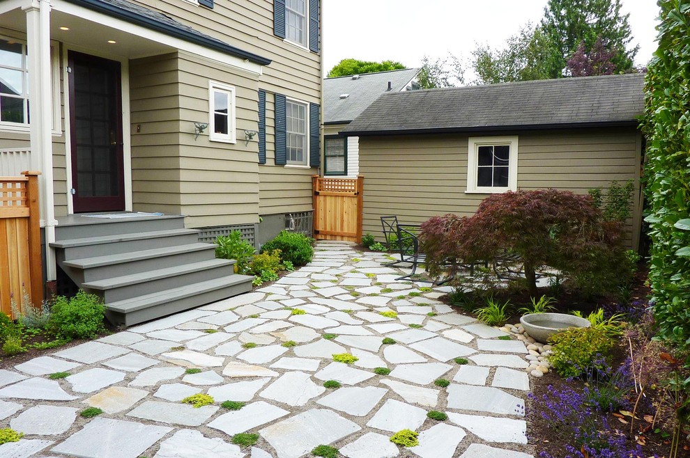Inspiration for a contemporary patio in Seattle with natural stone pavers.