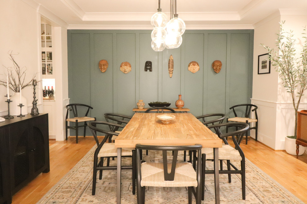 Inspiration for a large classic open plan dining room in DC Metro with blue walls, light hardwood flooring, no fireplace, brown floors, a coffered ceiling and wainscoting.
