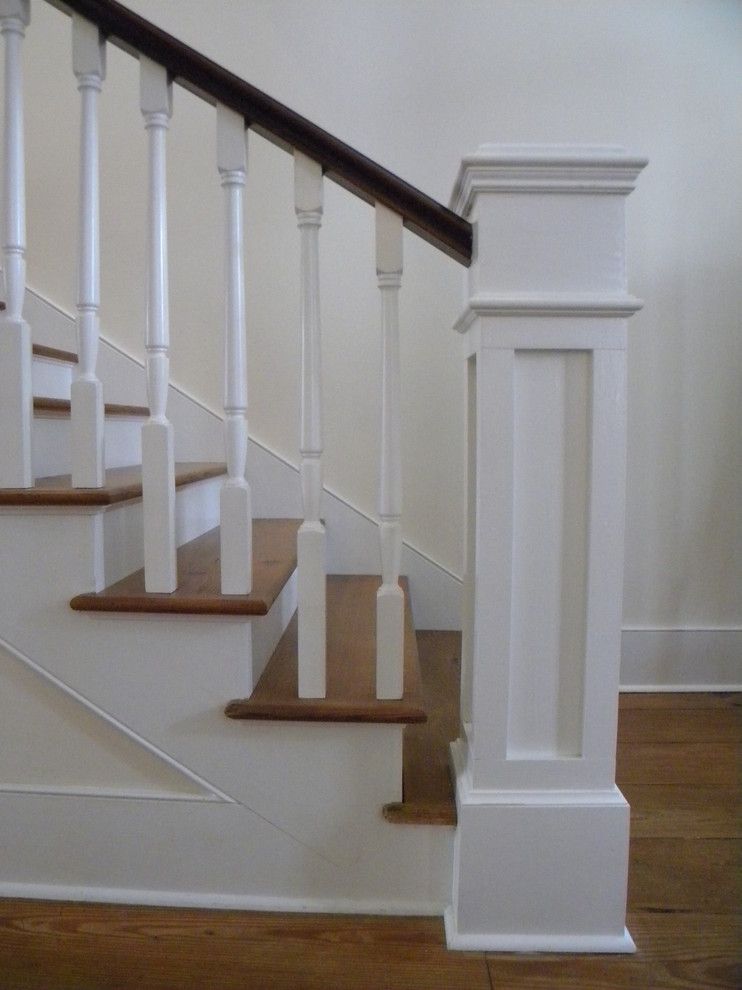 Design ideas for a mid-sized traditional wood straight staircase in Atlanta with wood risers.