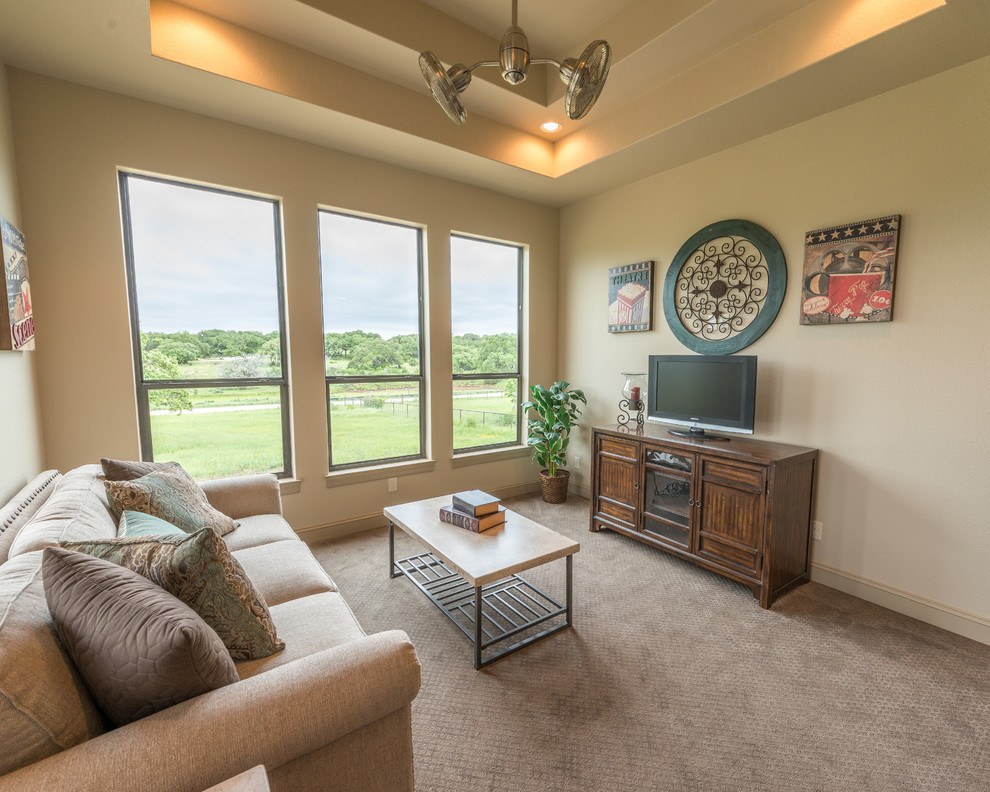 Mid-sized traditional enclosed family room in Austin with beige walls, carpet, no fireplace and a freestanding tv.
