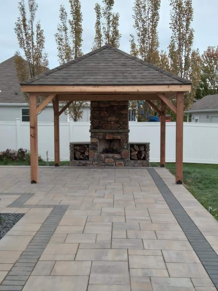Inspiration for a mid-sized arts and crafts backyard patio in Other with with fireplace and a pergola.