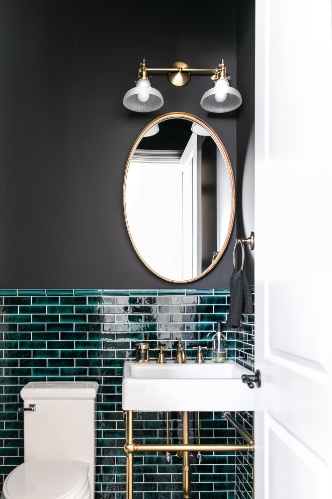 This is an example of a small transitional powder room in Calgary with green tile, black walls, mosaic tile floors, a pedestal sink and black floor.