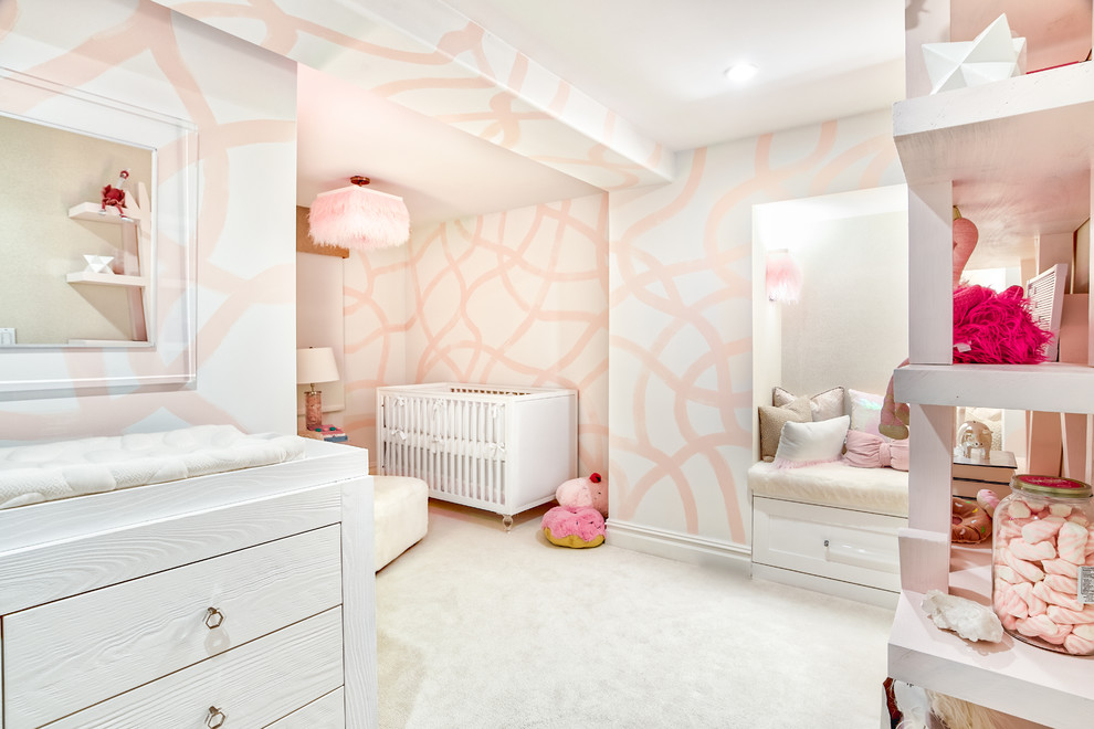 Small midcentury nursery in New York with multi-coloured walls, carpet and beige floor for girls.