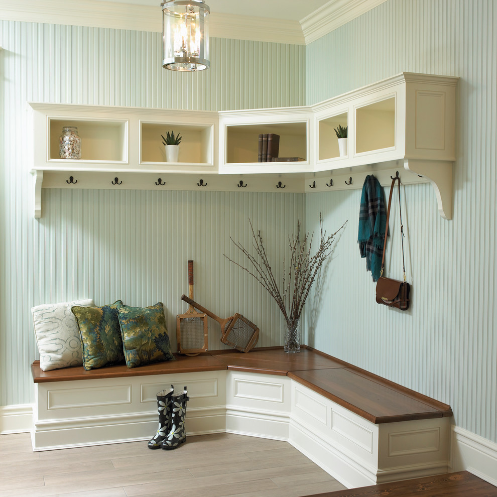 Inspiration for a traditional mudroom in Toronto with blue walls and light hardwood floors.