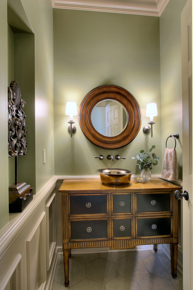 Photo of a traditional bathroom in Seattle with a vessel sink, green walls and flat-panel cabinets.