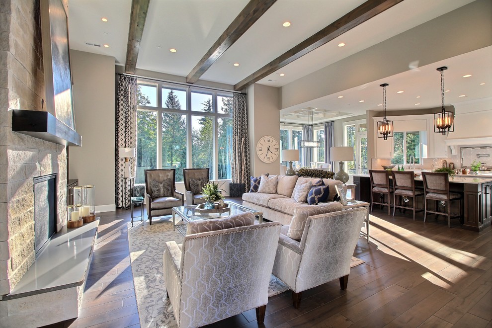 Design ideas for an expansive transitional open concept family room in Portland with a home bar, grey walls, dark hardwood floors, a standard fireplace, a stone fireplace surround and no tv.
