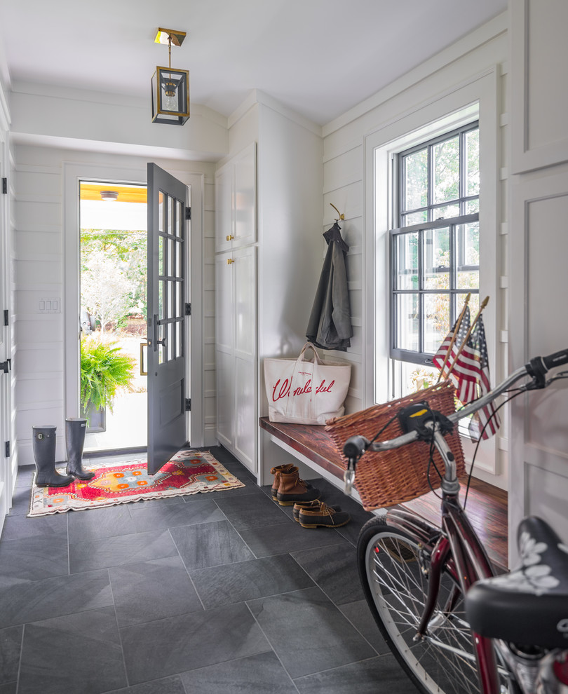 Beach style mudroom in Boston with white walls, a single front door, a gray front door and grey floor.
