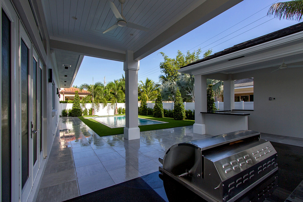 Example of a transitional home design design in Miami