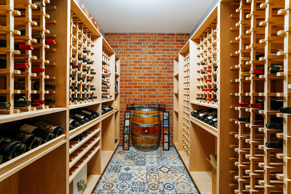 Traditional wine cellar in Denver with ceramic floors and storage racks.
