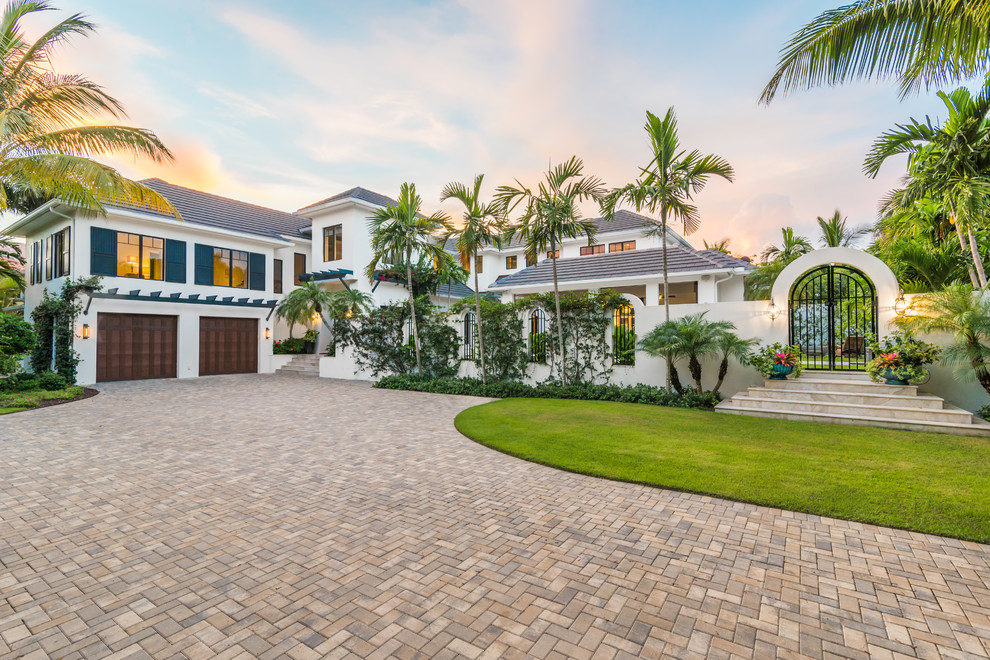 Design ideas for a tropical two-storey white house exterior in Miami.