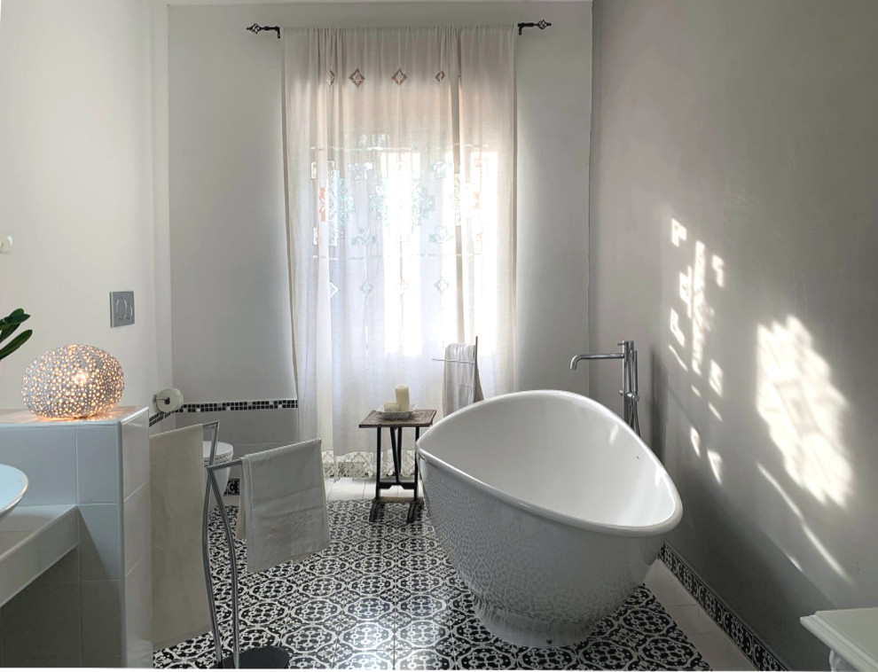 Design ideas for a large contemporary bathroom in Other with open cabinets, a two-piece toilet, black and white tile, mosaic tile, multi-coloured walls, ceramic floors, a console sink, tile benchtops, black floor and white benchtops.