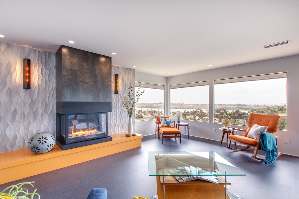 Photo of a contemporary formal open concept living room in San Diego with grey walls, a ribbon fireplace, no tv and concrete floors.