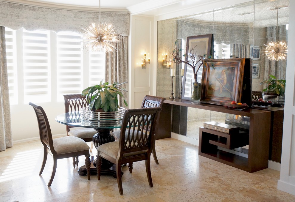 Photo of a mid-sized transitional open plan dining in Las Vegas with white walls, travertine floors and no fireplace.