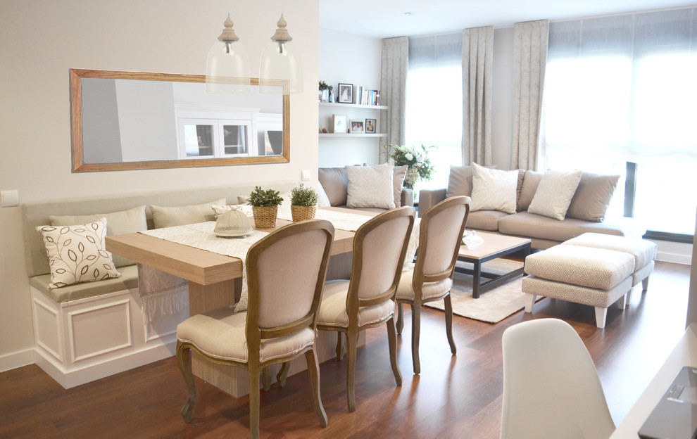 This is an example of a mid-sized transitional separate dining room in Madrid with beige walls, medium hardwood floors and brown floor.