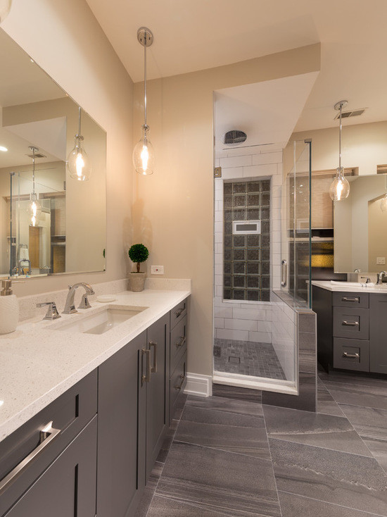 Inspiration for a mid-sized contemporary master bathroom in Chicago with recessed-panel cabinets, dark wood cabinets, an alcove shower, white tile, mosaic tile, beige walls, mosaic tile floors, an undermount sink and limestone benchtops.