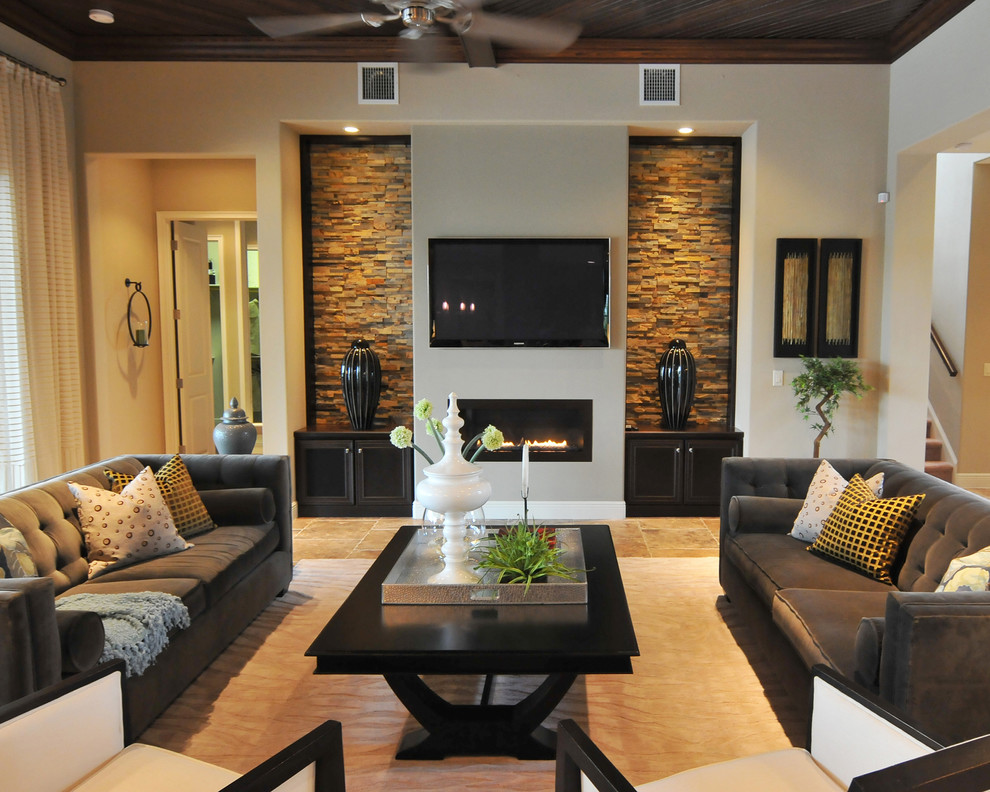 This is an example of a transitional formal living room in Orlando with beige walls, a standard fireplace, a wall-mounted tv, beige floor, wood and ceramic floors.
