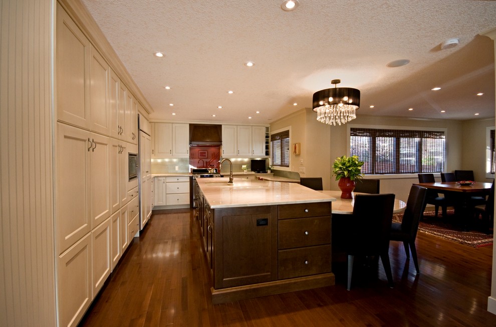 Example of a transitional kitchen design in Calgary