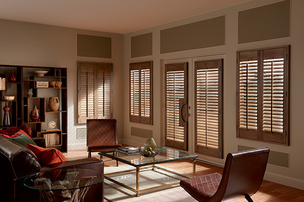 This is an example of a traditional living room in Houston with medium hardwood floors.