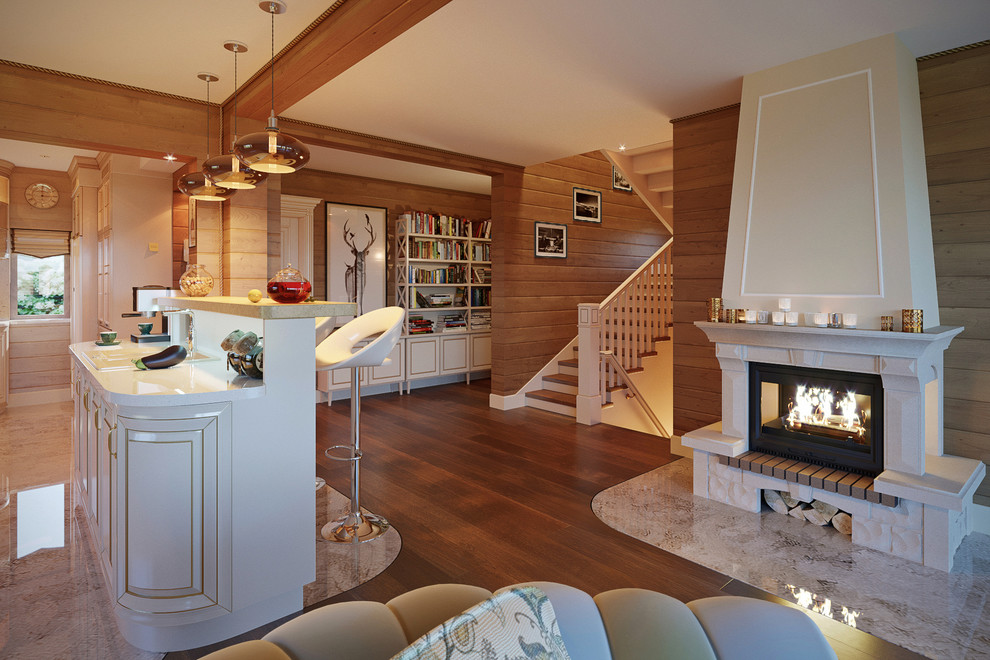 Вечерний вид на камин, барную стойку и лестницу.