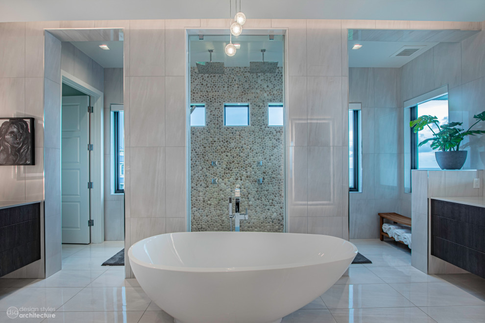 Expansive contemporary master bathroom in Tampa with flat-panel cabinets, dark wood cabinets, a japanese tub, a curbless shower, white tile, marble, white walls, porcelain floors, a drop-in sink, engineered quartz benchtops, white floor, an open shower, white benchtops, a shower seat, a double vanity and a built-in vanity.