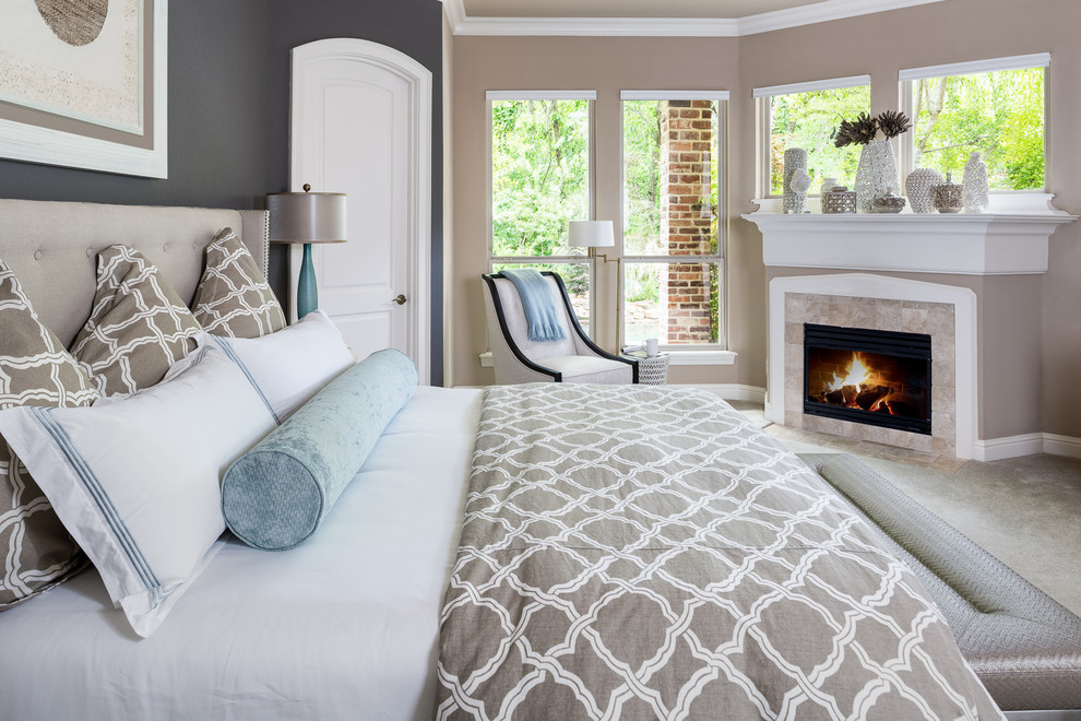 Design ideas for a large transitional master bedroom in Dallas with grey walls, carpet, a standard fireplace, a tile fireplace surround and beige floor.