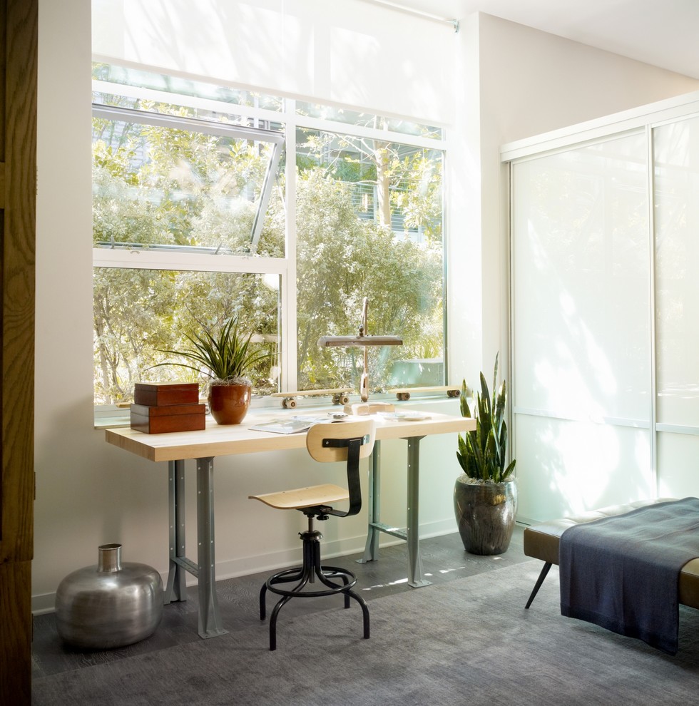 This is an example of an industrial home office in Los Angeles with white walls.