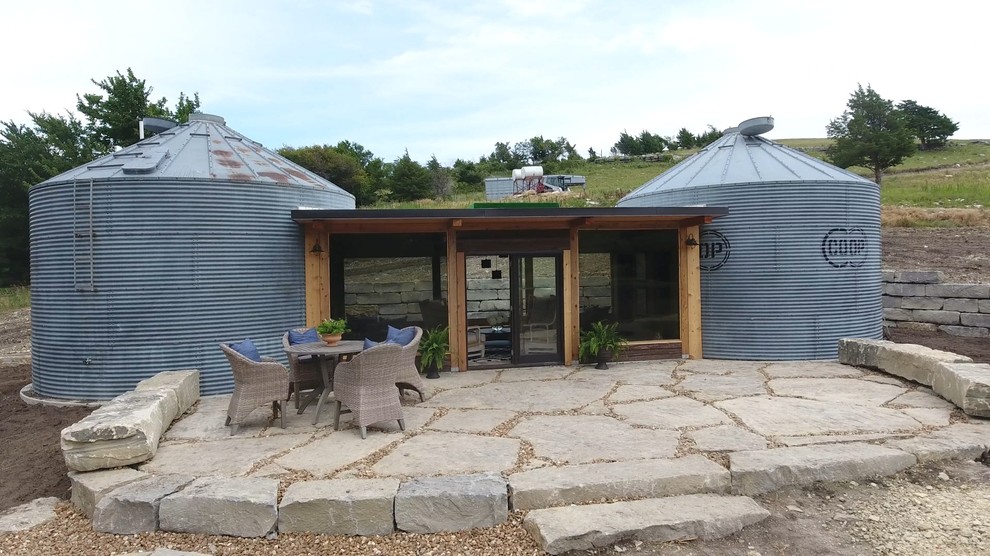 Inspiration for a small transitional one-story metal house exterior remodel