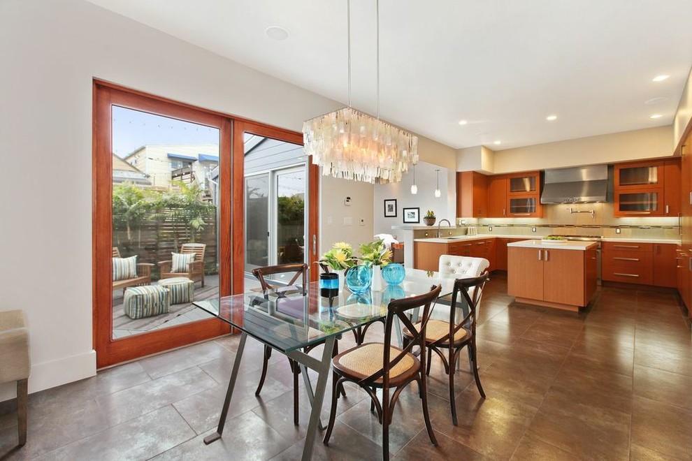 This is an example of a contemporary kitchen/dining combo in San Francisco with white walls.